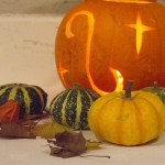 lit pumpkin and guards