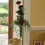 red rose tall vase table centerpiece