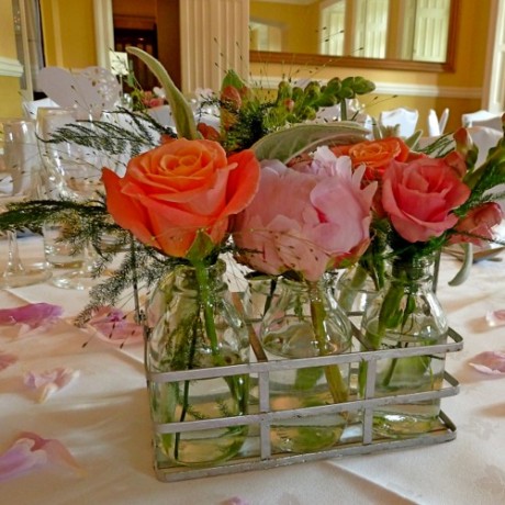 #sliderCaption11 Miniature milk bottle flower table decorations